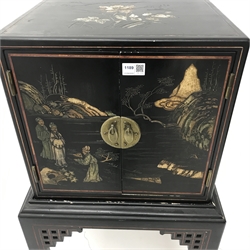  Early 20th century Chinoiserie ebonised cabinet on stand, two doors, square tapering supports, W51cm, H99cm, D47cm  
