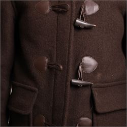Barbour and Aquascutum - three ladies’ coats, comprising a Barbour Classic Duffle in dark brown wool blend with toggle fastenings and signature tartan lining, size UK 8, together with two Aquascutum herringbone wool coats, each double-breasted and fully lined, both bearing Regent Street London labels (3)