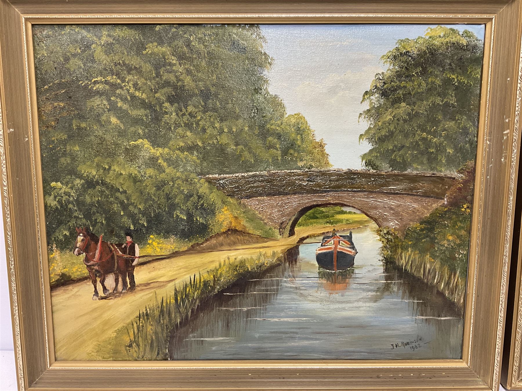 J H Robinson (British 20th century): Canal and Lake Landscape, pair oils on board, signed and dated 1982 (2)