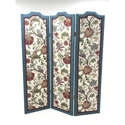 Three panel folding dress screen, upholstered with beige ground floral patterned fabric, W153cm, H181cm