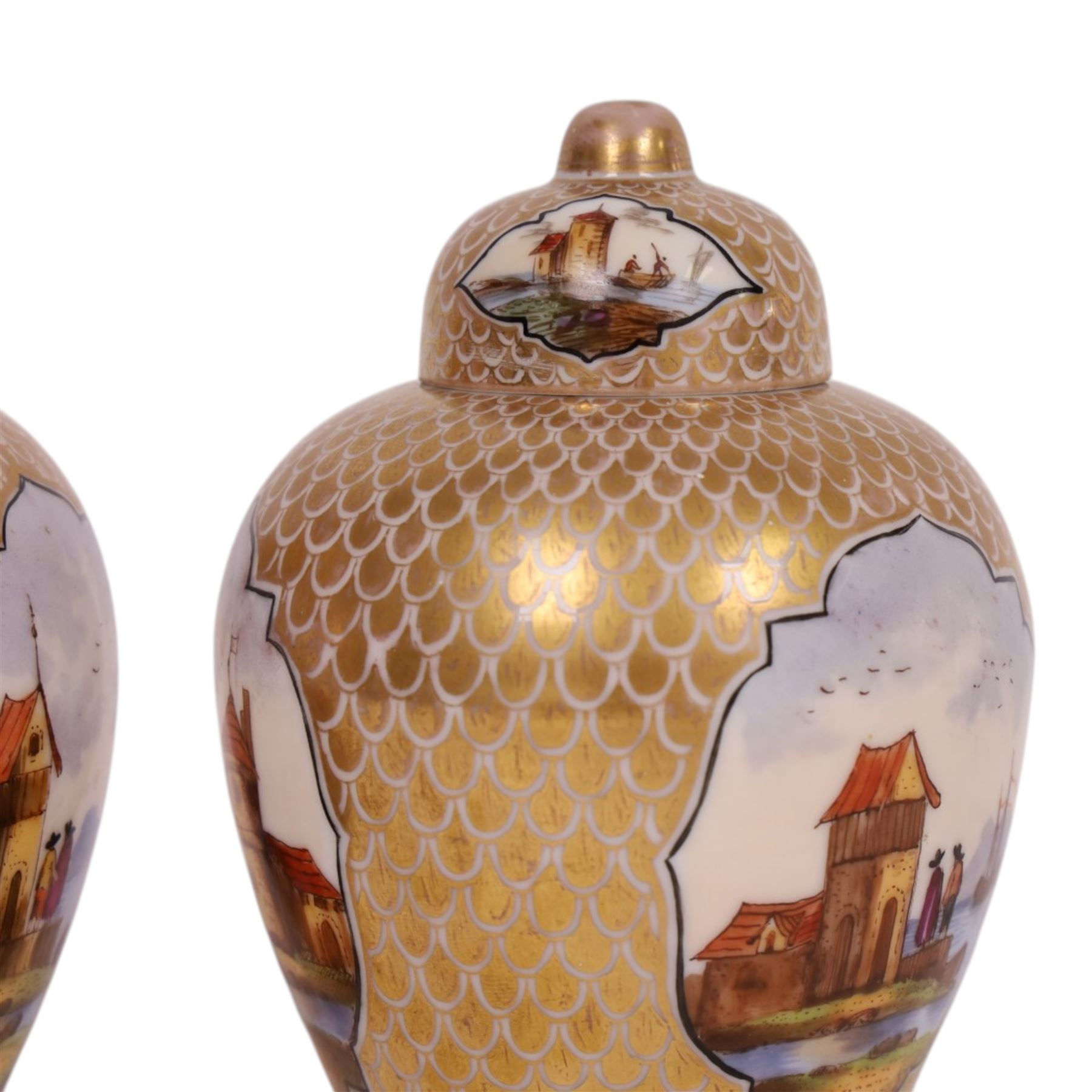 Pair of 19th century Dresden urn and covers, the central panels decorated with figures in landscapes, surrounded by gilt decoration, H15cm 