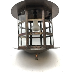  Arts & Crafts oxidised copper hall lantern, octagonal cage work shade with copper rivets and clear glass panels (lacking two), slightly domed top with loop handle on conforming base with turned finial, H40cm x D31cm approx  