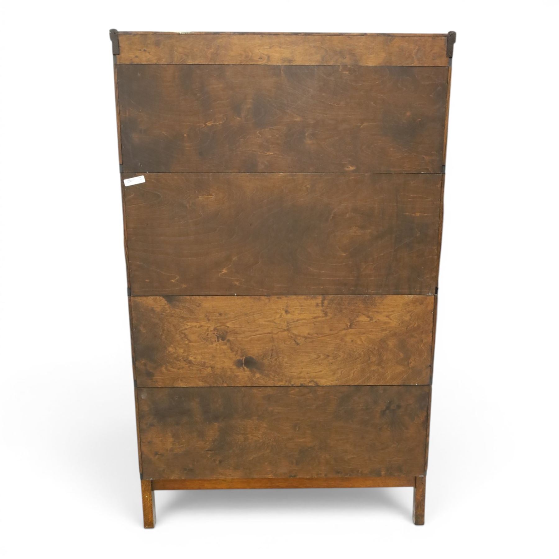 Globe Wernicke - oak four tier barrister bookcase, with leaded glazed fronts, raised on square supports