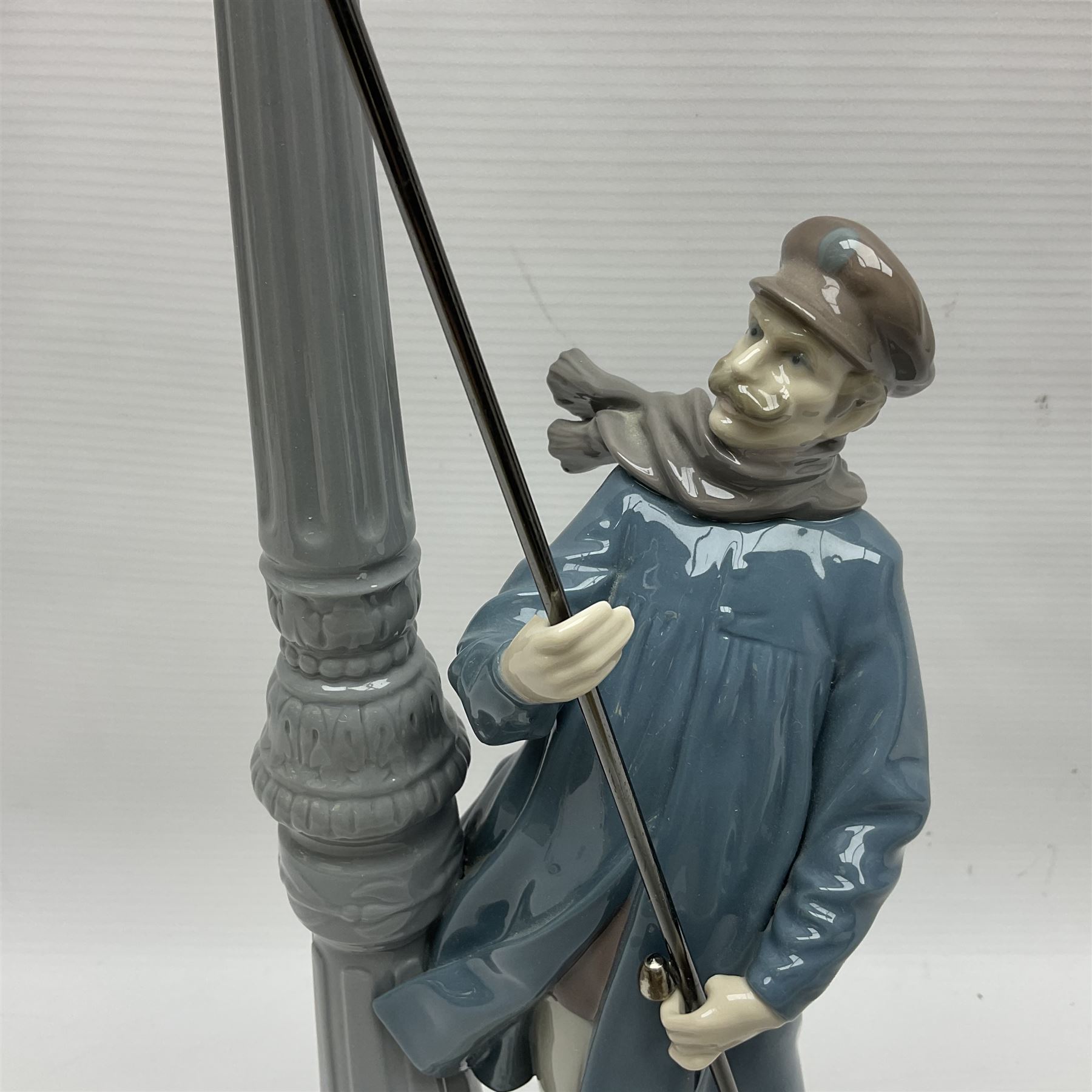 Five Lladro figures, including The Lamp Lighter no 5205,  Girl and Kittens no 6102, Cat no 5113 etc