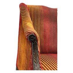 Mid-19th century mahogany two-seat sofa, upholstered in striped velvet fabric, the shaped backrest leading to outward-curved arms, carved apron with scrolling foliate details, raised on cabriole supports terminating in claw and ball feet