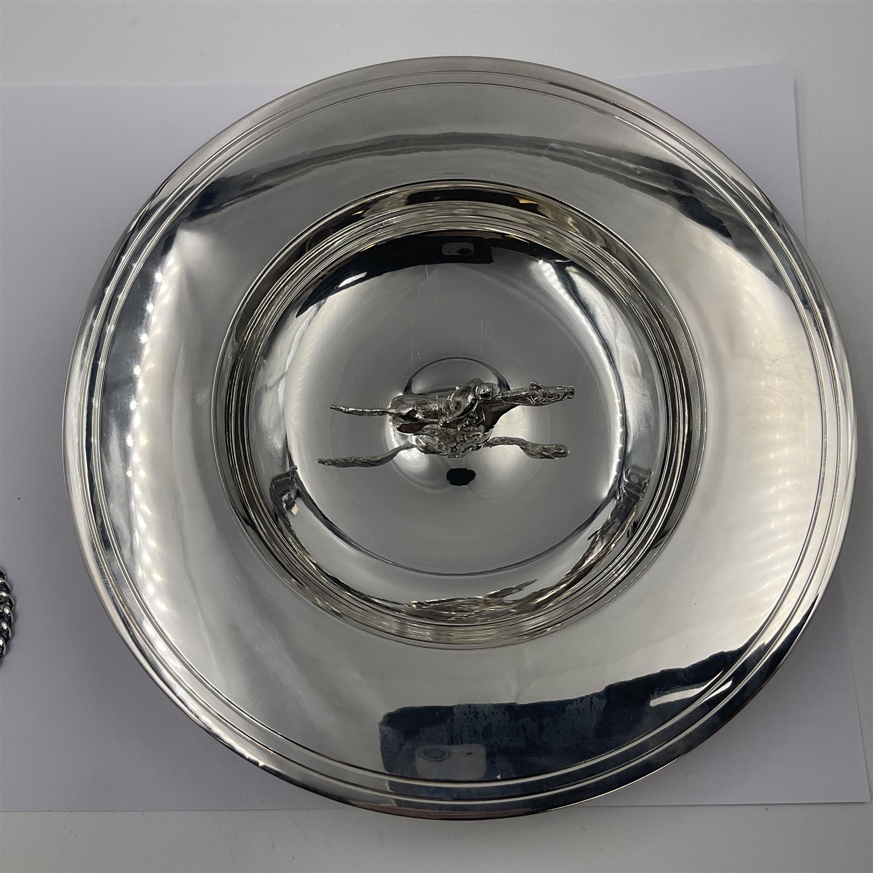 Spanish silver coin dish, with white metal chain rim and upon three ball feet, together with a silver plated armada style dish, with cast racehorse and jockey to centre, coin dish D4.8cm, armada dish D20.5cm
