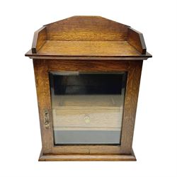  Edwardian oak smokers cabinet with the single glazed door to fitted interior having a single draw and pipe rack, H40cm