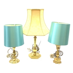 Three gilt table lamps, to include one example with acanthus detailed stem, each with shade, largest including shade H63cm
