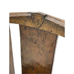 'Gnomeman' oak hall chair, the cresting rail carved with shield, plain rectangular back on figured canted seat, shaped upright end supports pierced with star motif, on sledge feet joined by stretcher, carved with gnome figure, tooled and adzed all over

Provenance - This collection of early 'Gnomeman' furniture comes to us directly from the Whittaker family. The pieces were made by the vendor's father Thomas Whittaker in the 1930/40s for his own use. During this time, he lived in York and made items for himself and friends. Whittaker adopted the gnome as a signature and trademark after his move to Littlebeck, Whitby.