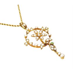 Early 20th century 15ct gold pearl, diamond and garnet pendant necklace, the flower wreath pendant, set with split pearls, a single old cut diamond  and green garnet, on a rope twist necklace, both stamped 15c