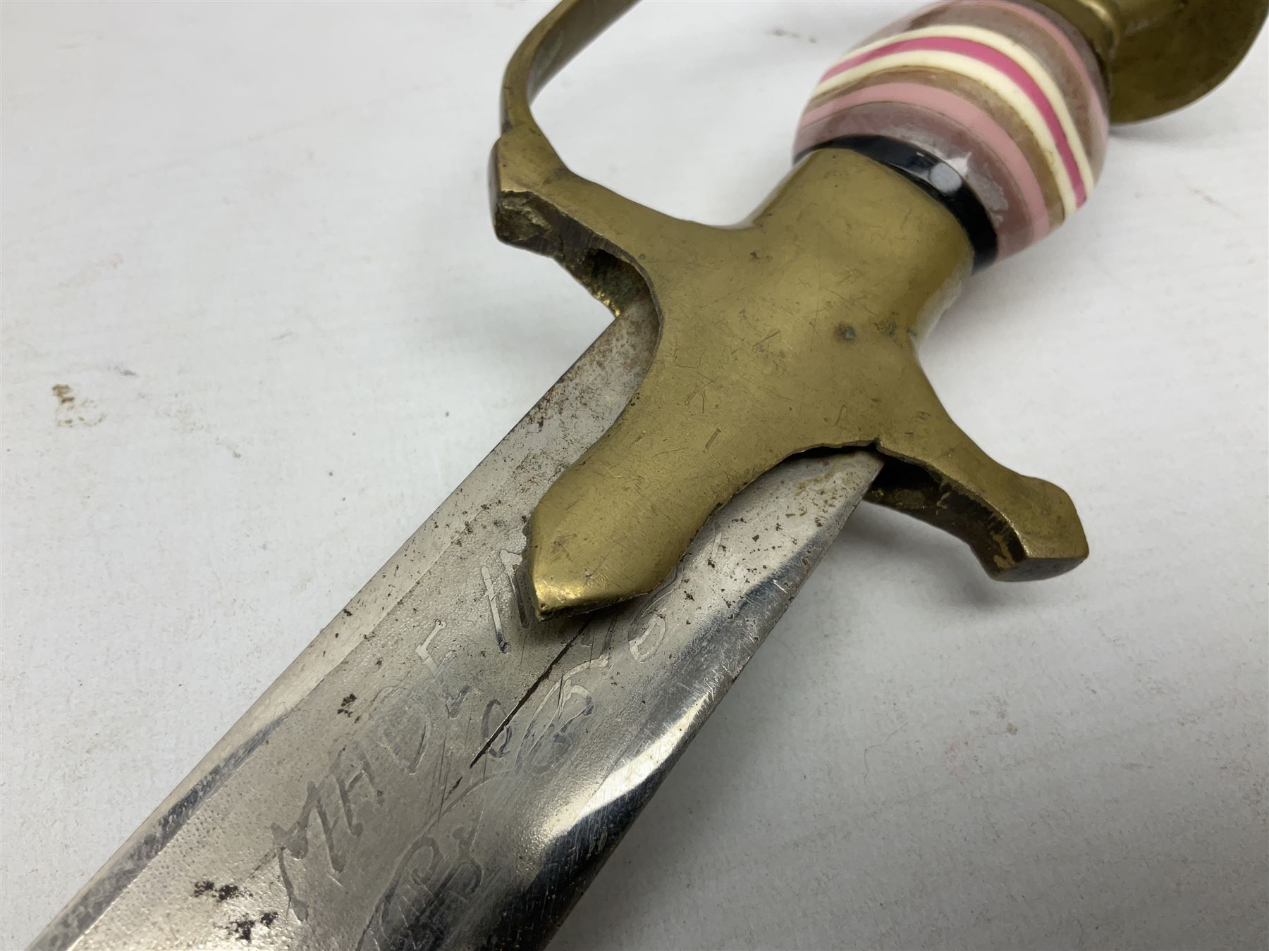 Early 20th century Indian ebonised sword stick, the 59.5cm blade with punched decoration and horn grip L94cm overall; and a reproduction Indian tulwar with scabbard (2)