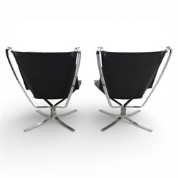Pair of modernist black leather and chrome armchairs, in the manner of  Vatne Møbler, black leather sling seats suspended within chromed steel brackets, supported by polished chrome cross bases
