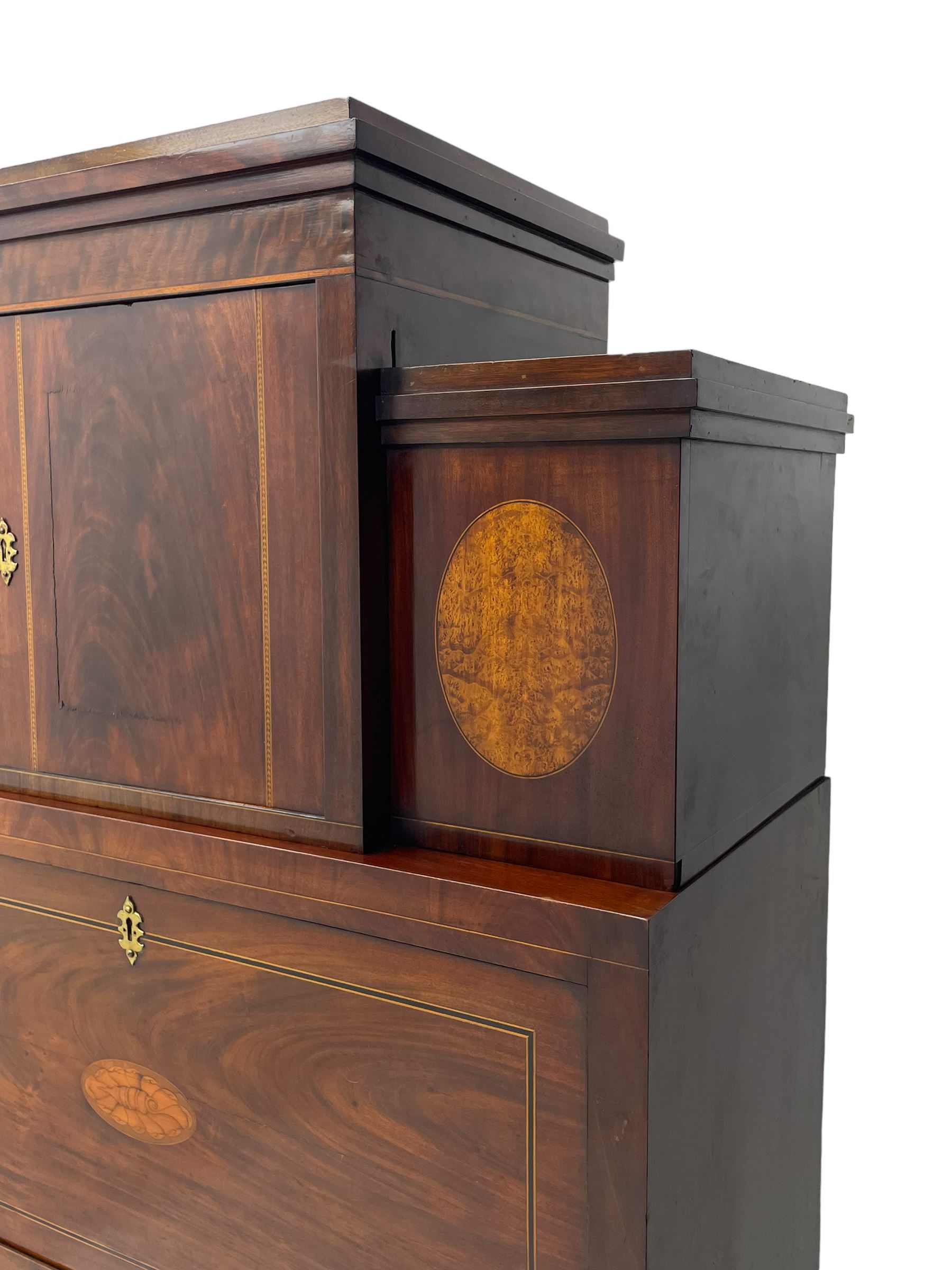 Early to mid-19th century figured mahogany Continental secrétaire à abattant, stepped top fitted with single cupboard, inlaid with oval figured amboyna panels, the fall front inlaid with shell motif enclosing a satinwood interior fitted with cupboard, drawers, and pigeon holes, three long drawers below, on square tapering feet