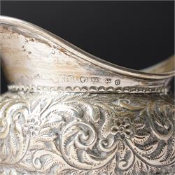 George III silver cream jug with crimped rim and scroll handle, Victorian silver cream jug with embossed decoration Birmingham 1888 and three silver golf spoons Birmingham 1961