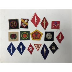 Approximately one-hundred printed and embroidered cloth badges including I, II, VIII, XI, XII and XXX Corps, Eastern Command, various Armoured Divisions, Midland, Wessex, Home Counties and 12th Infantry Brigades, Salisbury Plain, Northumberland, Hampshire, North Midland, West Riding, Essex and Suffolk Districts, Berlin & Rhine Army Troops etc