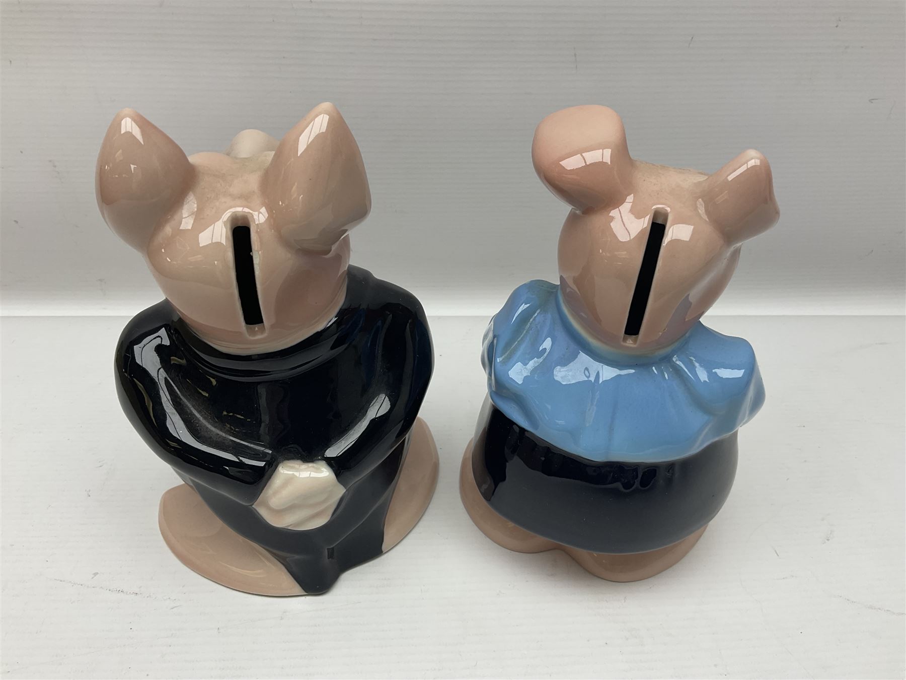 Set of five Wade NatWest money boxes, comprising father, mother, boy, girl and baby