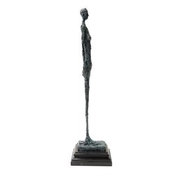 After Alberto Giacometti (Swiss 1901-1966): Femme Venise bronze upon a stepped marble base, overall H49cm