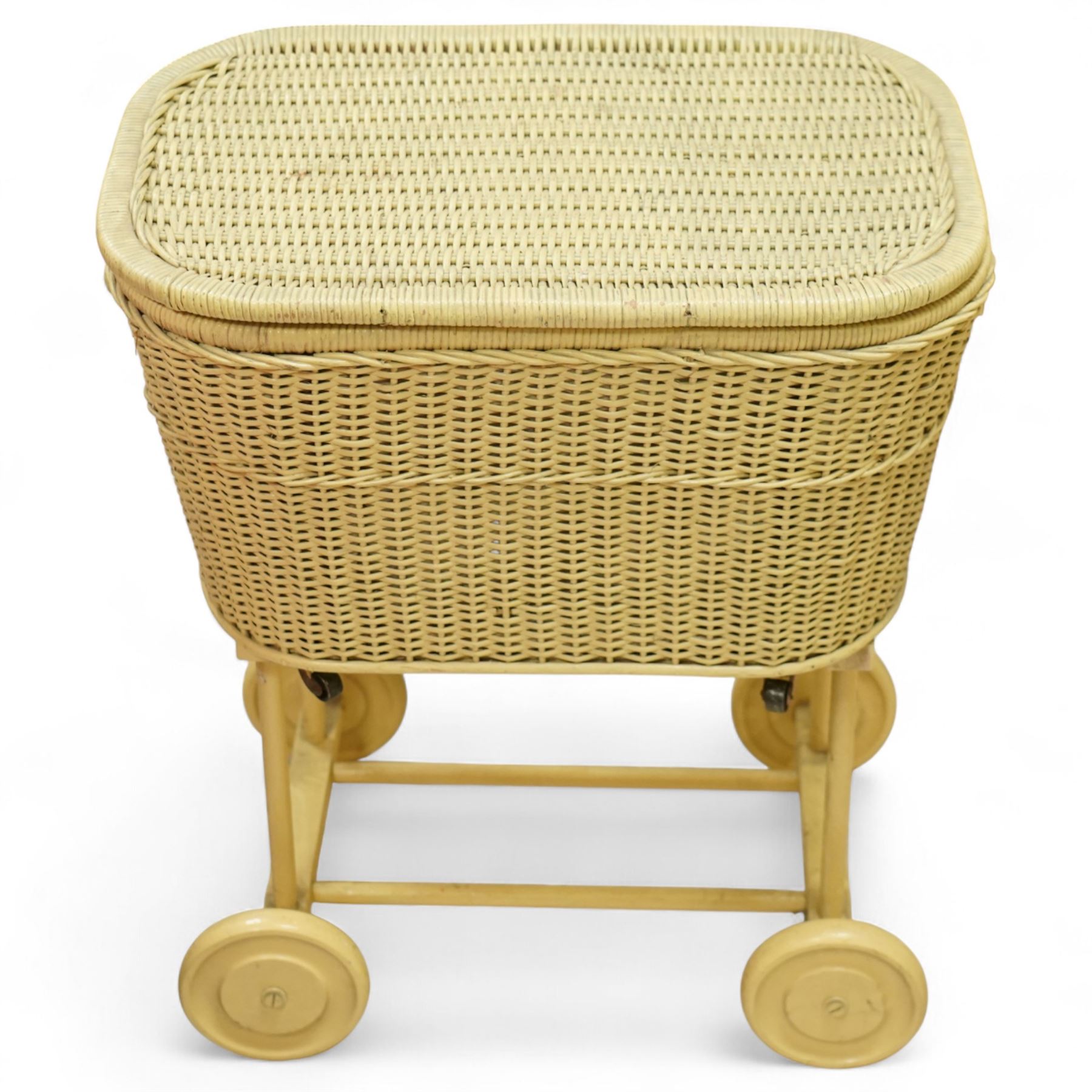 *Mid 20th century nursery set, comprising a cream painted metal cot with adjustable base, a wicker baby basket on wheeled stand, and a folding nursery screen with printed fabric panels decorated with playful animal and teddy bear motifs

Cot (H 112cm, W 136cm, D 77cm)
Screen (H 139cm, W 148cm) 
Basket (H 72cm, W 59cm, D 40cm)From the Kirkham Hall Attic & Cellar Collection, sold without reserve