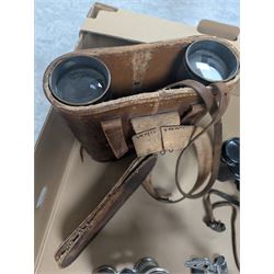 Three pairs of binoculars including Wrayvu 8x30 and Busch Hellux, together with a tabletop magnifying glass
