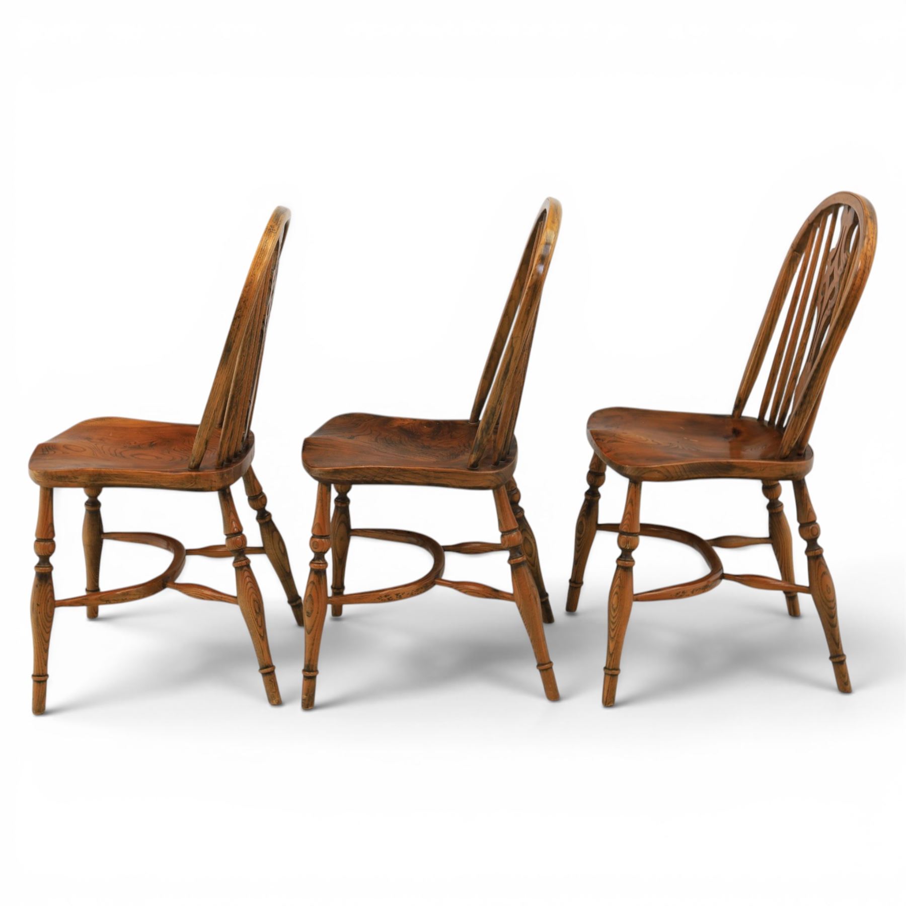Set of six elm Windsor chairs, saddle seats with crinoline stretchers