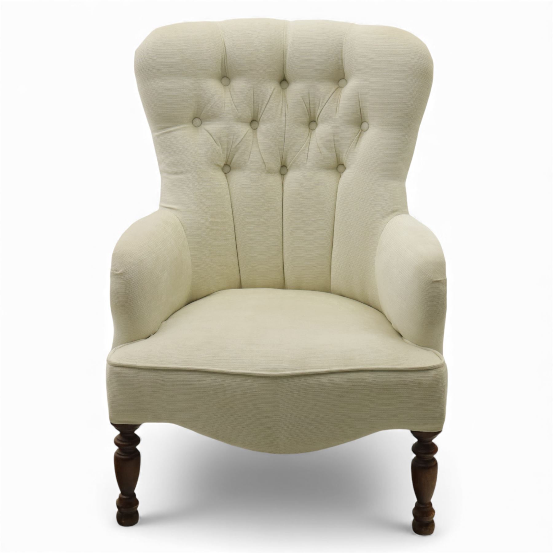 Late 20th century cream upholstered nursing chair, high button-tufted back with shaped wings, scroll arms, loose seat cushion, raised on turned front supports