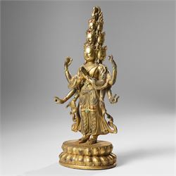 Tibetan gilt bronze figure of Ekadashamukha Avalokiteshvara, standing upright on lotus base, his primary hands in anjali mudra, the other six radiating to the sides, H28cm; together with a gilt bronze figure of Ganesh or Ganapati, H26cm (2)
