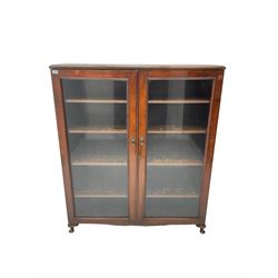 19th century mahogany bookcase display cabinet, two glazed doors enclosing four adjustable shelves, raised on cabriole feet (W123cm D34cm H146cm); together with another similar (W116cm D29cm H142cm)