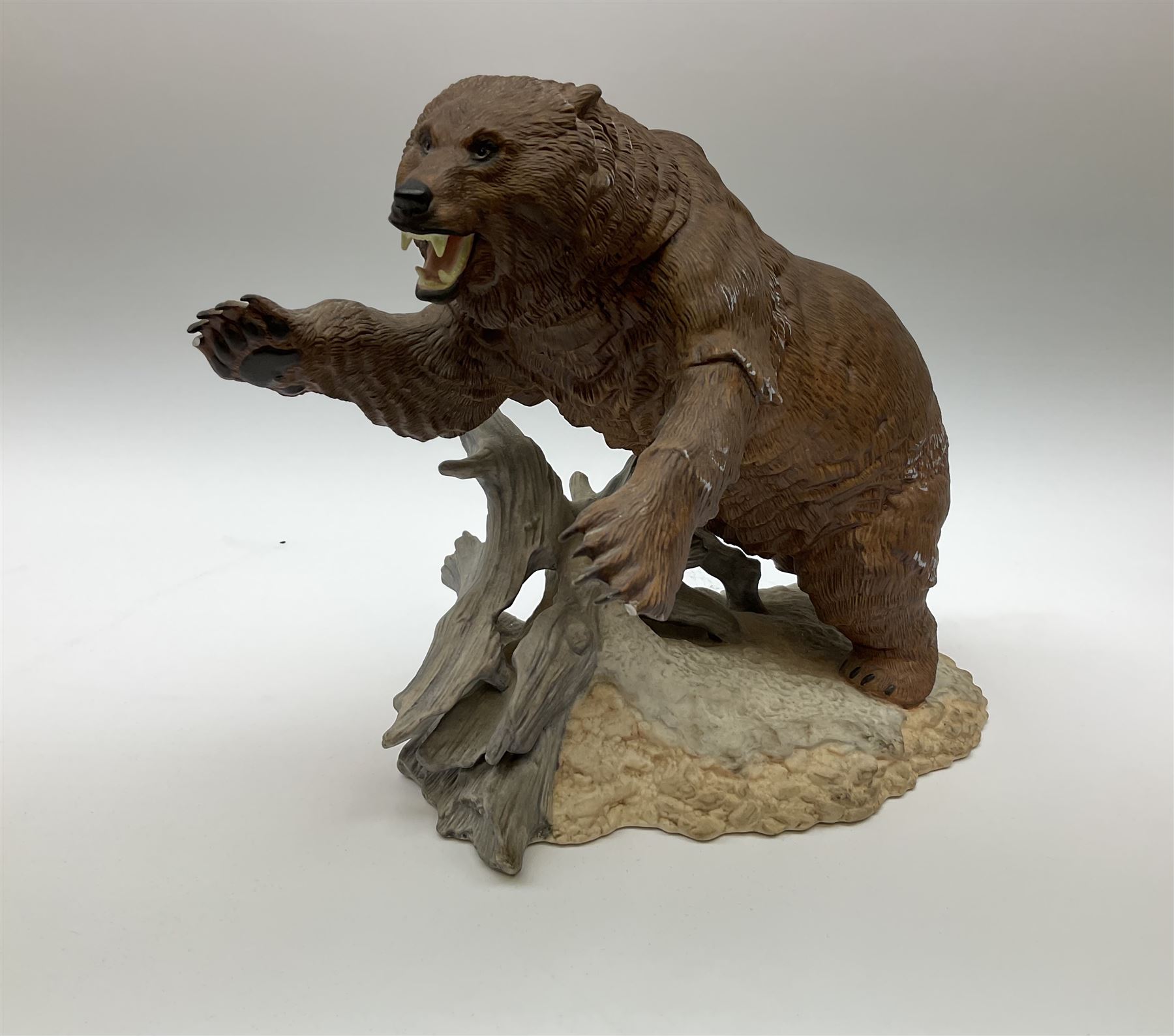 Three Franklin Mint figures, first example On The Prowl, on wooden stand H32cm, L63.5cm, Grizzly, H23cm and American Majesty by Ronald Van Ruyckevelt H37cm, together with five other figures.  
