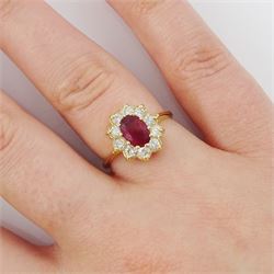 14ct gold oval cut ruby and round brilliant cut diamond cluster ring, stamped, ruby approx 0.90 carat, total diamond weight approx 0.50 carat