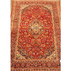  Persian Kashan red ground rug carpet, central medallion on field of interlacing stylised flowers, repeating border, 312cm x 208cm  