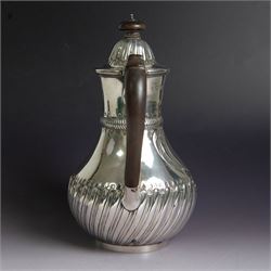 Victorian silver coffee pot, of part fluted baluster form, with central oval cartouche engraved with peryton crest, bordered by C scrolls and chased scales, with impressed acorns, stars and leaves throughout, with wooden handle and finial to domed hinged cover, hallmarked Charles Stuart Harris, London 1883, H23cm