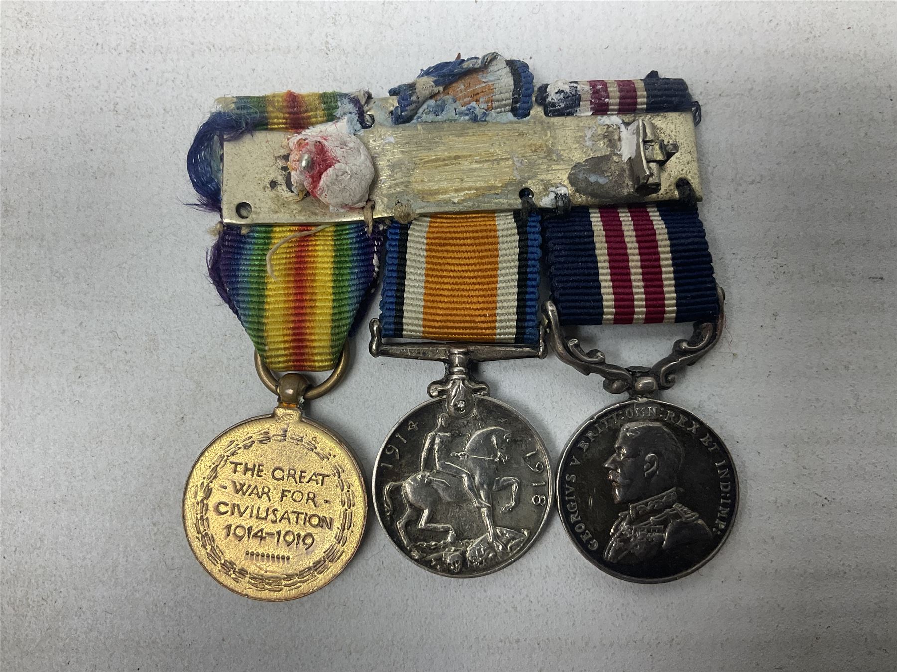 George V Military Medal and Distinguished Conduct Medal miniature group of seven medals comprising MM, DCM, WW1 trio including 1914 Star with date clasp and MID leaves, The Great Durbar Delhi 1911 Medal and LSGC; on pinned wearing bar; WW1 Military Medal miniature group of three comprising MM, BWM and Victory; Victoria North West Canada 1885 miniature; and George VI miniature Territorial Efficiency medal; all with ribbons