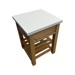 Contemporary butchers block kitchen trolley, white square top over beech frame, single pull-out drawer, dual slatted shelves, chrome towel rails, raised on square supports with castors