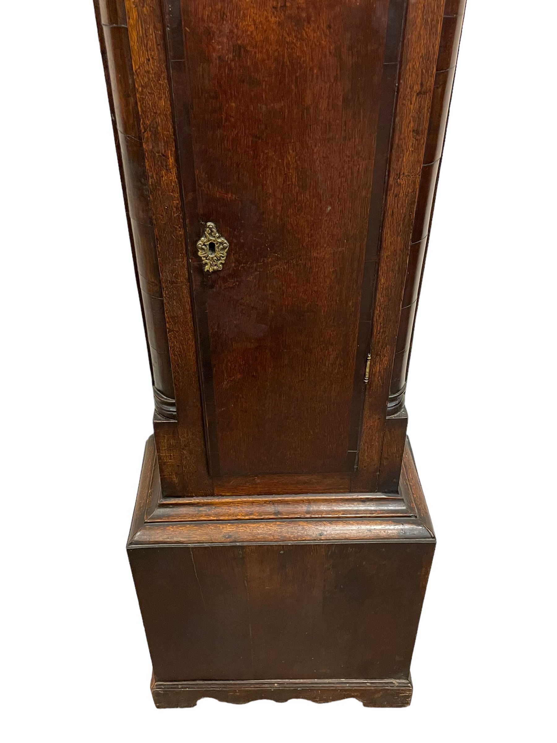 William Lister (II) of Keighley – 8-day 18th century oak cased longcase clock c1760, hood with a break front flat topped pediment and eglomise  frieze beneath, square hood door flanked by matching pilasters with gesso capitals, trunk with quarter columns and long trunk door with a flat top and convex shoulders, square plinth with a decorative skirting, 12” brass dial with rococo spandrels, engraved dial center, silvered chapter with Roman numerals, five minute Arabic’s, half hour markers and minute track, semi-circular apertures with engraved calendar and moon phase/lunar age discs, original blue steel fretted hands, four pillar rack striking movement with a recoil anchor escapement, striking the hours on a bell. With pendulum, weights and key.
The Lister family were a prolific family of clockmakers working in the West Riding of Yorkshire during the 18th century. Working in various locations including Halifax, Keighley and Luddenden.
William Lister (I) is recorded as working in Keighley from 1715-37 and his son William (II) from 1735-1785.
