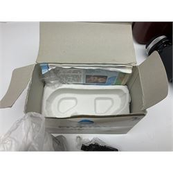 Four Minolta camera bodies, to include Dynax 500si, serial no. 94812651 with 'Signa Zoom 1;3.5-4.5 f=28-70mm' lens, Maxxum 300si, serial no. 97821665, with 'Tamron AF 80-210mm' lens and Dynax 300si, serial no 01603265'  with Minolta AF Power Zoom 35-80mm 1;4' lens, etc, together with Pantax MV1 camera bodies and other camera equipment 