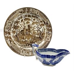 Early 19th century David Dunderdale & Co Castleford pottery plate, decorated in brown in the Buffalo and Ruins pattern, with indistinct impressed marks beneath, D24cm, together with a late 18th/early 19th century blue and white pearlware sauce boat, decorated in a variant of the Willow pattern, L15cm