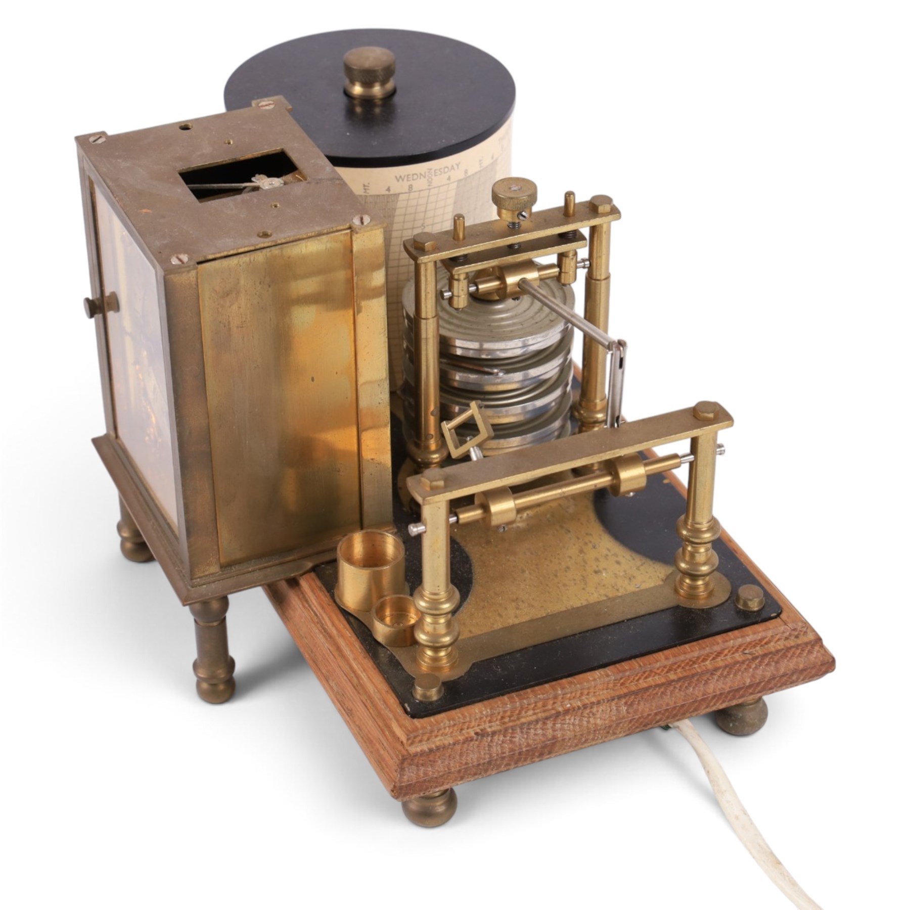 Brass barograph with integral brass clock, upon a wooden wooden plinth