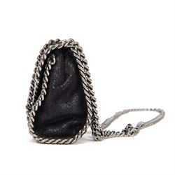 Stella McCartney Falabella black shaggy deer cross-body bag, the compact foldover design with signature silver-tone curb chain trim and chain strap, logo disc charm and pink logo lining, stamped Stella McCartney Made in Italy, with dust bag