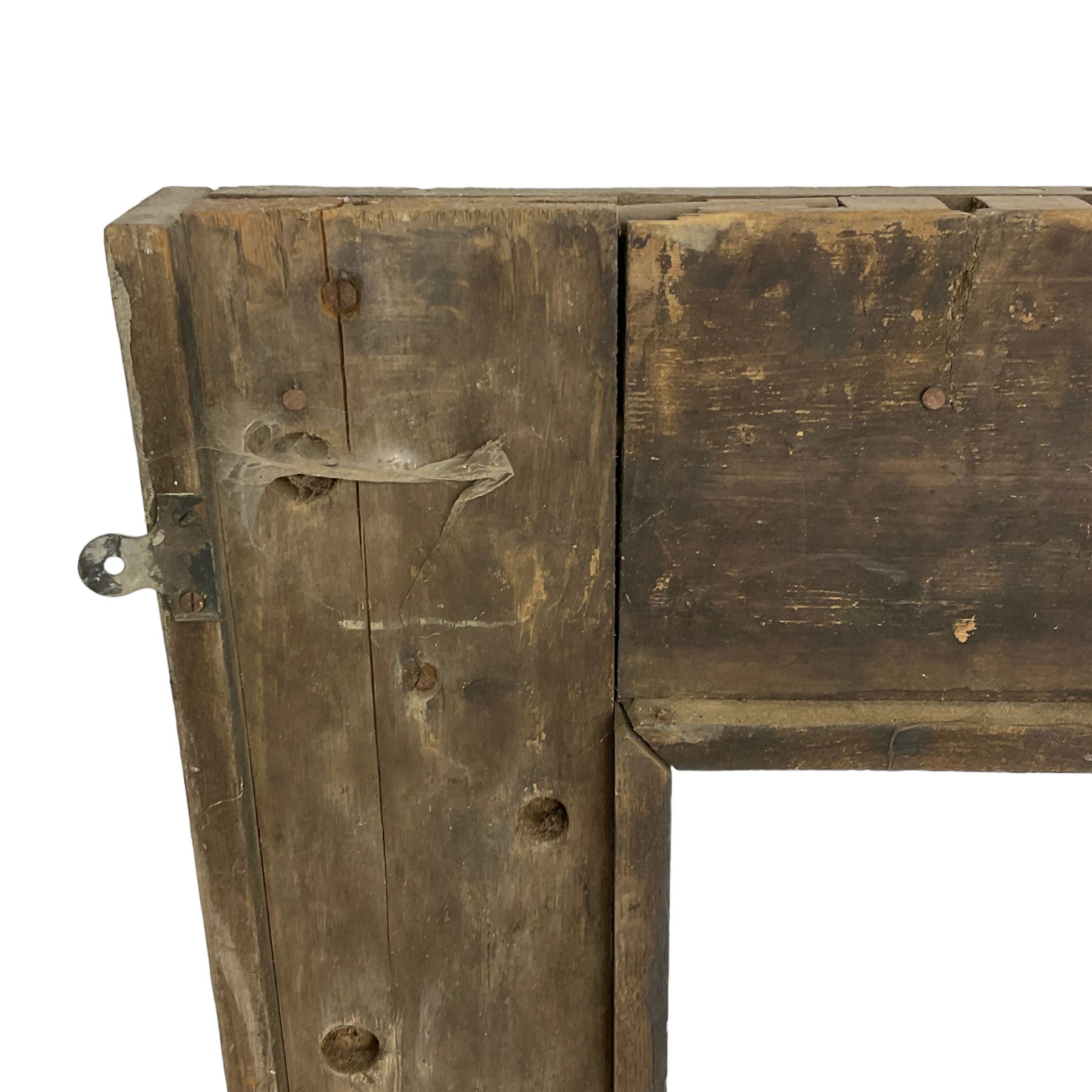 19th century Jacobean Revival oak fire surround, decorated with applied carved panels depicting foliate patterns and stylised grape vines, uprights carved with fleur-de-lis decoration