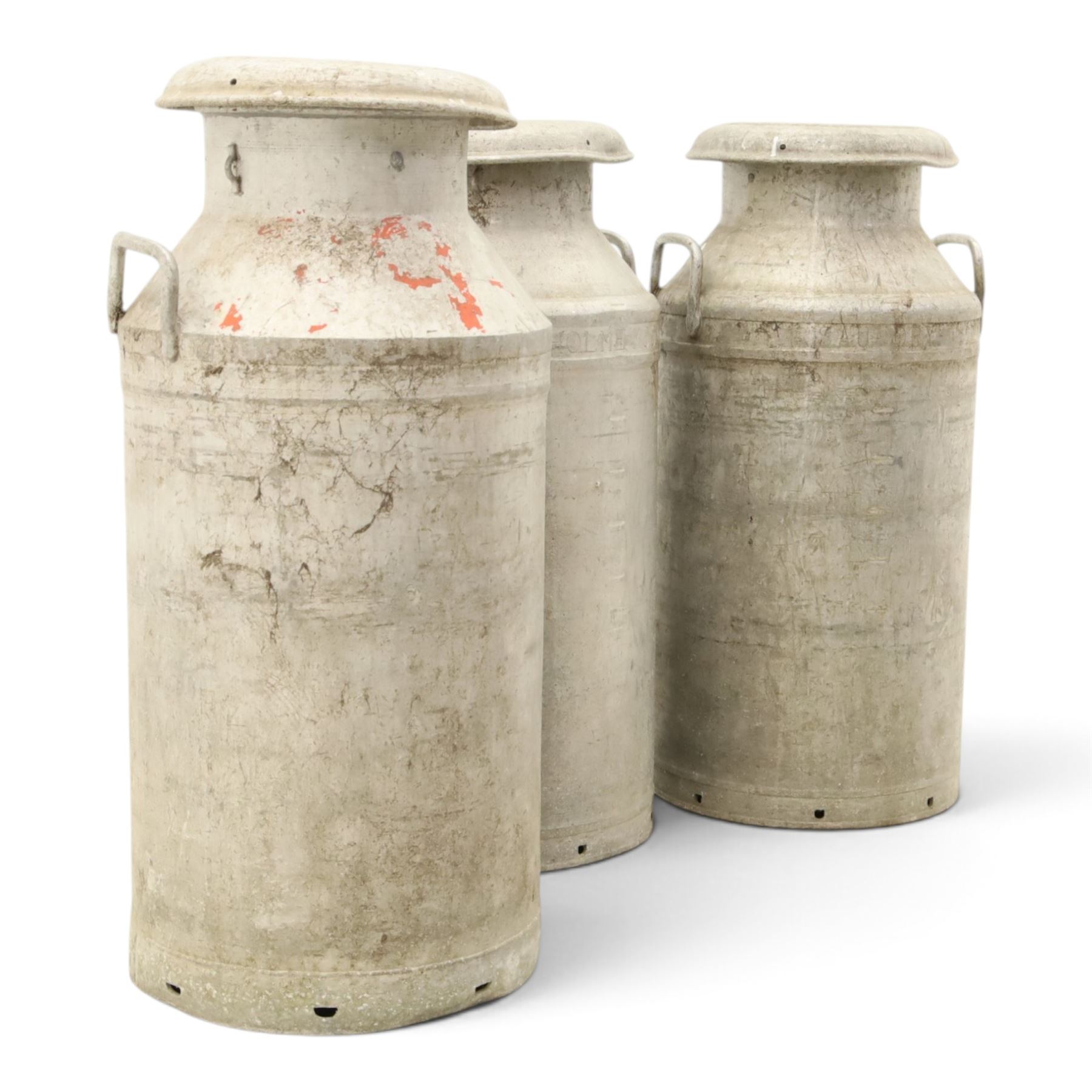 20th century aluminium set of three milk churns, with handles, baring the stamps of 'Middlesborough Co-op', 'Holme Moor', 'Wholesale Dairies' 