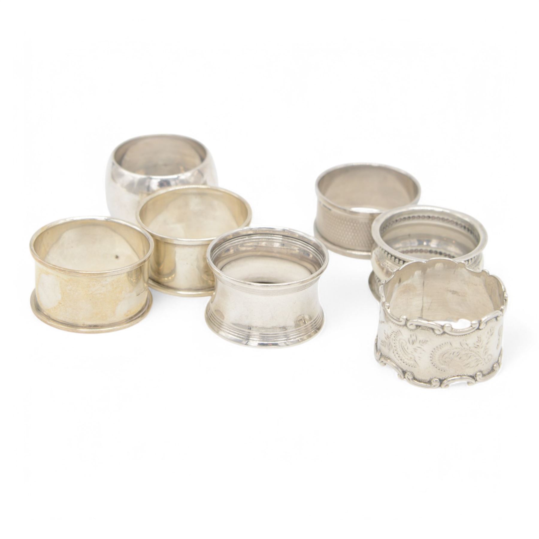 Collection of silver napkin rings and flatware, including set of Chinese bamboo design teaspoons with character mark finials, stamped 90, three pairs of Georgian and later sugar tongs, Scottish silver mustard spoon, hallmarked W S Junior, Glasgow 1833, cruet spoons, coffee spoons, etc, all stamped or hallmarked 