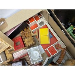 Large quantity of 1970s doll's house furniture, predominantly stained or painted wooden, including lounge, dining room, kitchen and bedroom pieces, bathroom fittings, bureaux and desks, piano, lamps, fire-surrounds etc; various scales