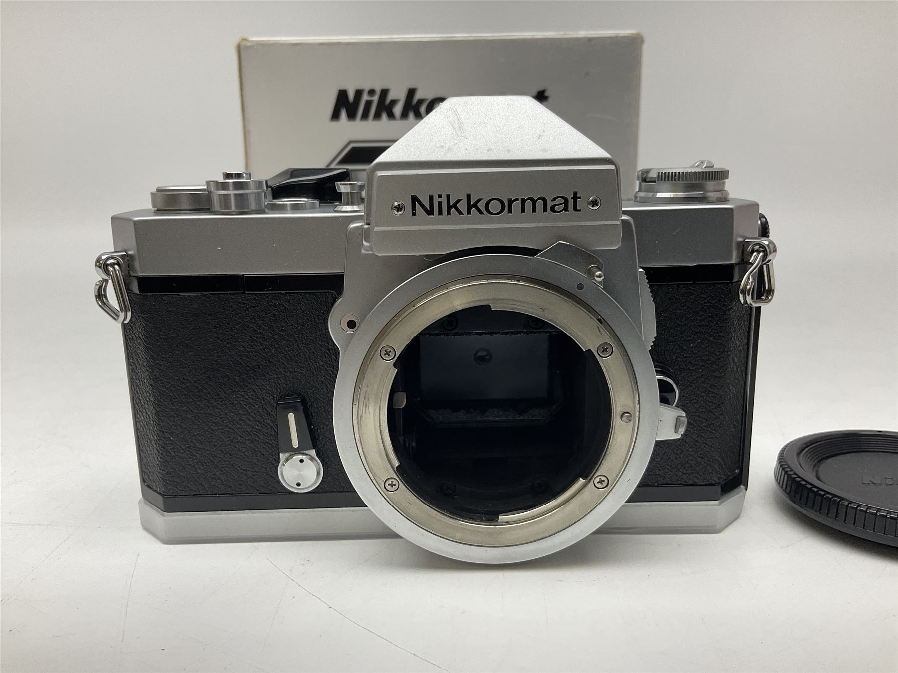 Nikkormat FT2 camera body, serial no. 5066813, in original packaging, together with Nikkormat EL camera body, serial no. 5577358, with Nikon Nikkor 50mm 1:1.8' lens no. 2143575, Nikkormat FT, serial no. 3968385, and Nikomat FT camera body, serial no. 4015491