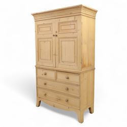 Georgian design waxed pine linen press, dentil moulded cornice above a pair of panelled cupboard doors enclosing storage interior, over two short and two long drawers with turned wooden knobs, raised on shaped bracket supports