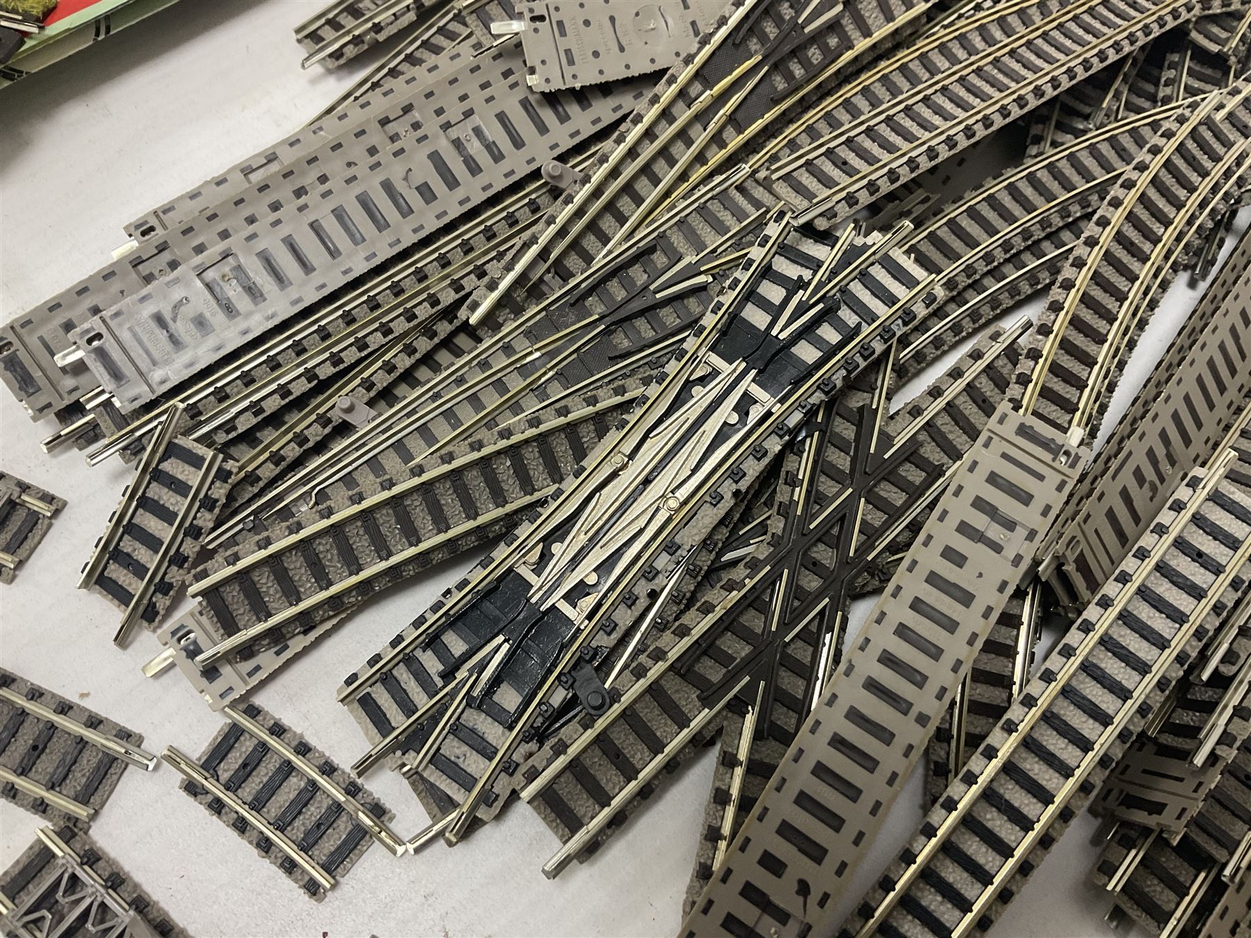 Fleischmann ‘N’ gauge - quantity of track, couplings, switches and accessories to include no.9481 Dump Car Unloader, two transformers and a mid 1980s Fleischmann catalogue 