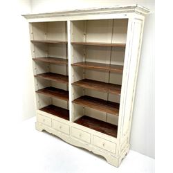Laura Ashley Bramley range French style cream painted open bookcase, eight adjustable shelves above four drawers, shaped plinth base