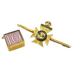 Early 20th century gold 'The Kings Royal Rifle Corps' brooch, stamped 15ct and 9ct money charm, hallmarked