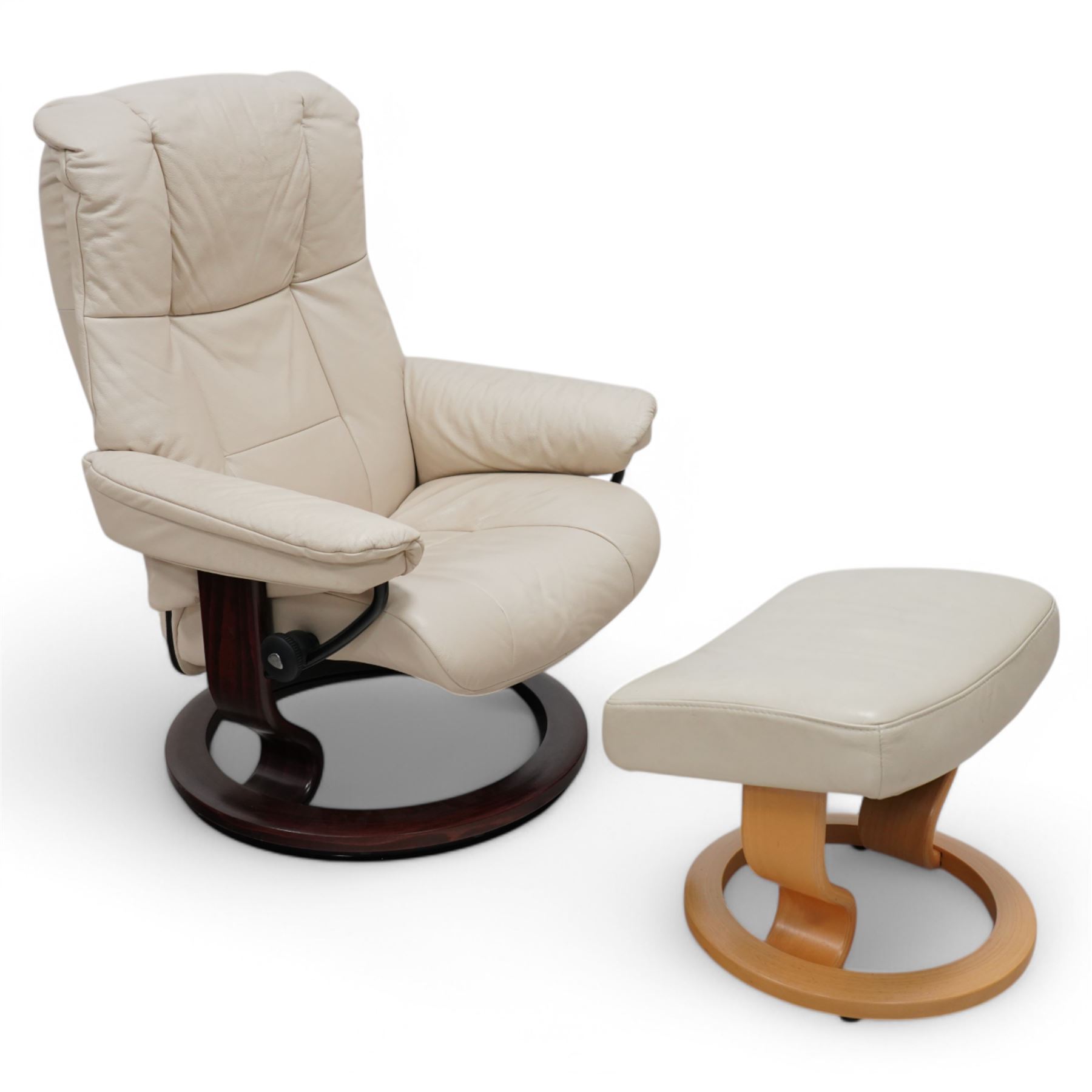 Ekornes - Stressless chair with stool, with padded arms and high backrest, raised on a circular mahogany-stained swivel base, fitted with reclining tension adjustment handle, supplied with stool with a lighter wood base 