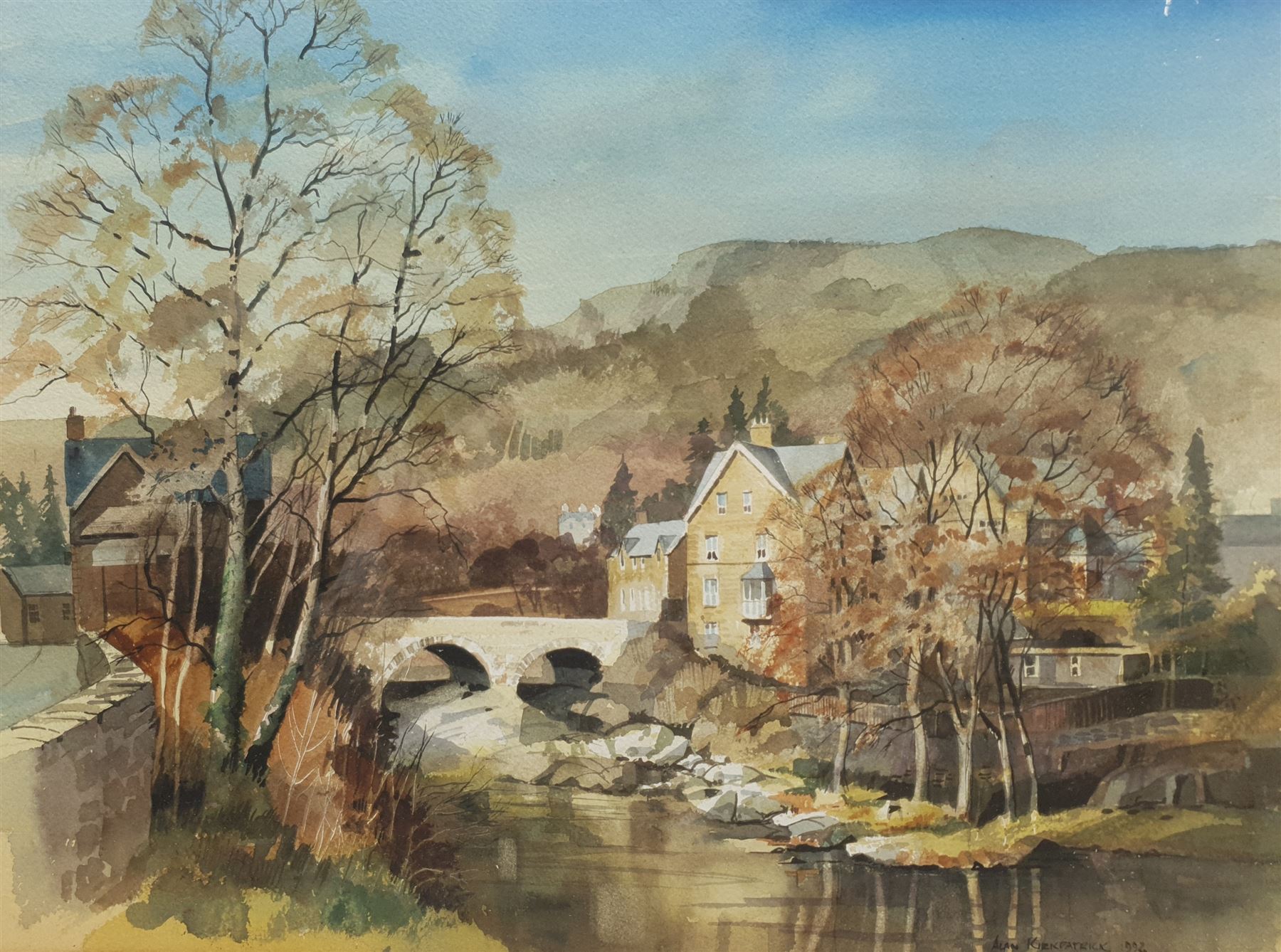 Alan Kirkpatrick (British 1929-): Welsh Village with River, watercolour signed and dated 1992, 39cm x 52cm