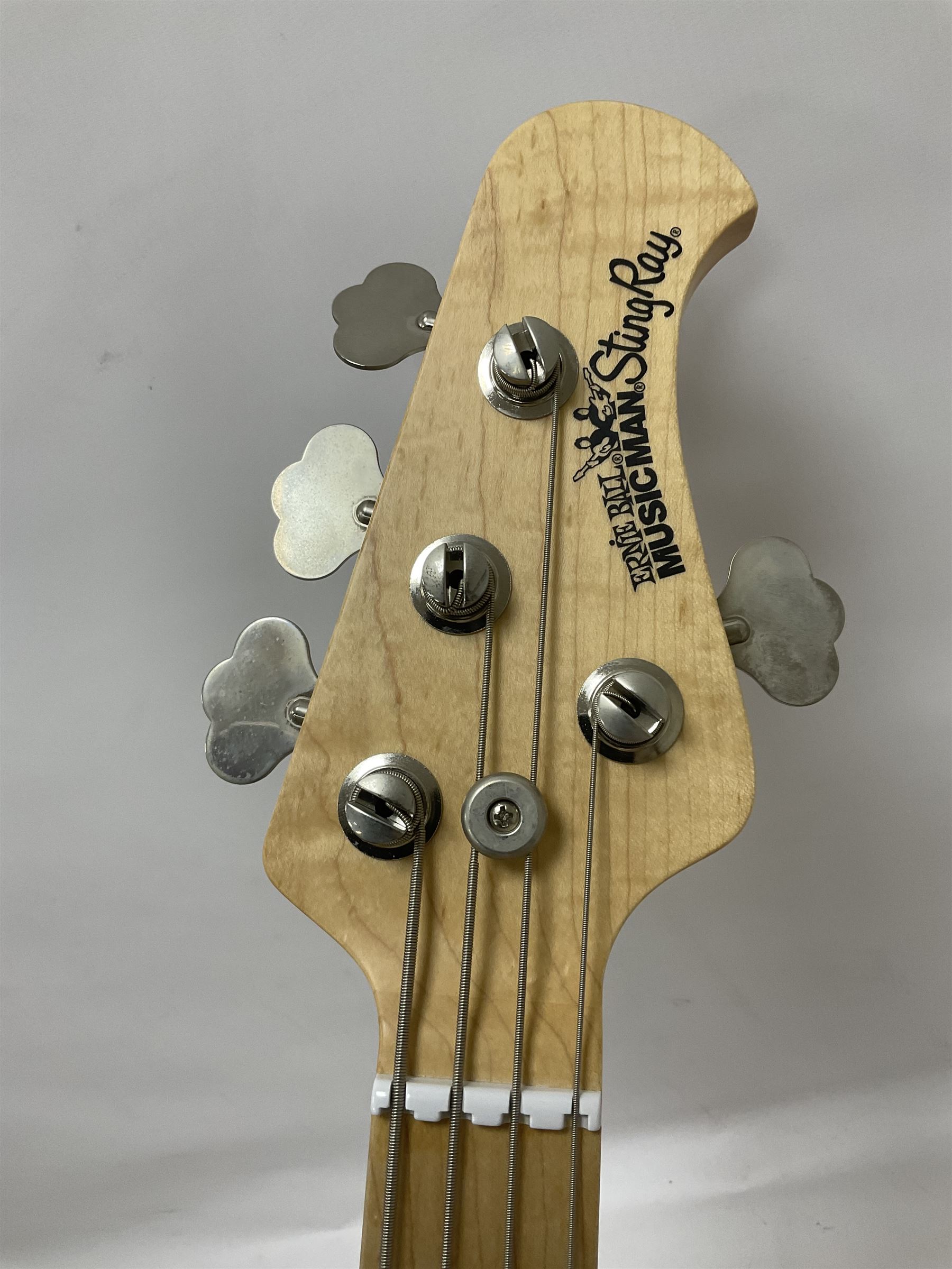 Ernie Ball Music Man Sting Ray 4 string bass guitar, in natural finish with roasted maple neck and tortoiseshell effect scratch guard, serial no 87485, in black Music Man hard case, guitar L114cm
